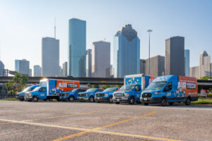 air tech of pasadena trucks in front of city backdrop
