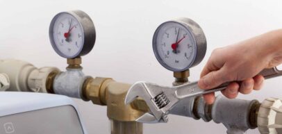 Plumber adjusting pressure valve