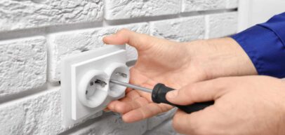 electrician installing outlet
