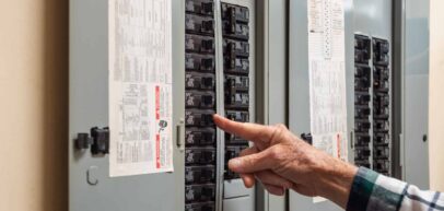 Electrician flipping breakers